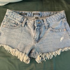 wild fable low rise light wash jean shorts with frayed edges